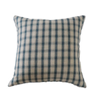 Plaid pillow with blue and beige pattern on a white background