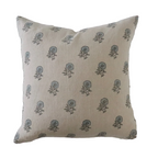 Beige pillow with blue floral pattern on a white background