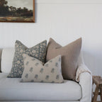 White sofa with patterned cushions in a room setting