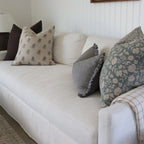 White sofa with decorative pillows in a living room setting