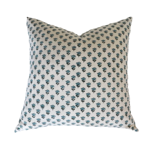 Decorative pillow with blue floral pattern on beige background
