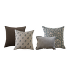 Four decorative pillows with different patterns on a white background