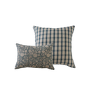 Two decorative pillows, one with floral pattern and the other with plaid pattern, on a white background.